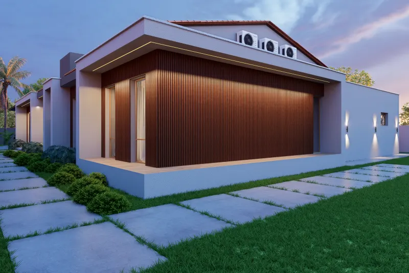 Fachada lateral ao entardecer com painéis ripados, iluminação exterior e relvado circundante