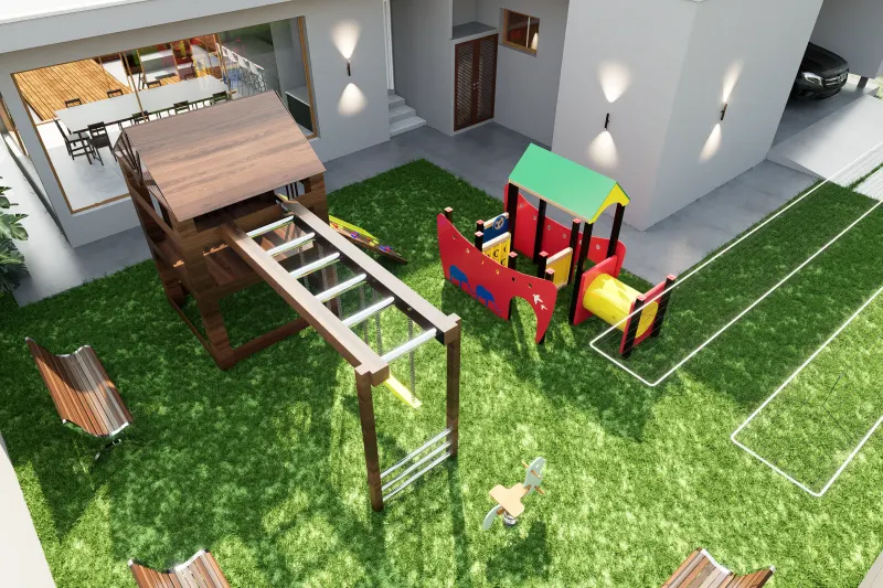 Parque infantil no jardim dos fundos com equipamentos de recreio e relva