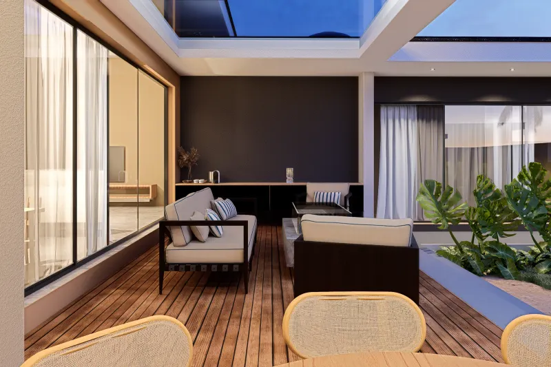 Área de estar no terraço ao entardecer com deck e iluminação acolhedora