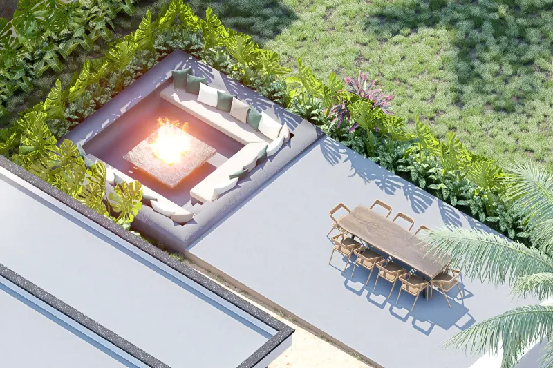 Vista aérea de lounge exterior rebaixado com fogueira e mesa de refeições.