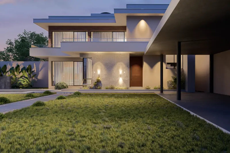 Fachada frontal iluminada ao crepúsculo com caminho pedonal e vegetação decorativa