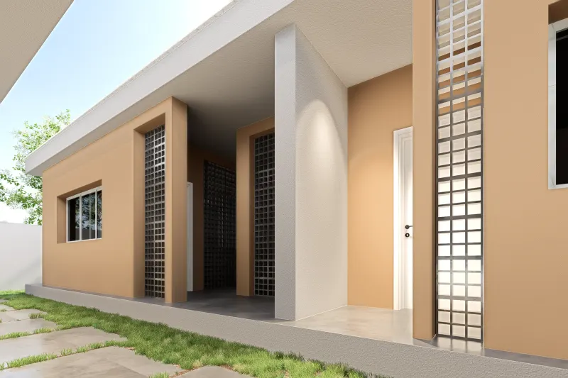 Fachada lateral de anexo com elementos vazados tipo cobogó e iluminação pontual