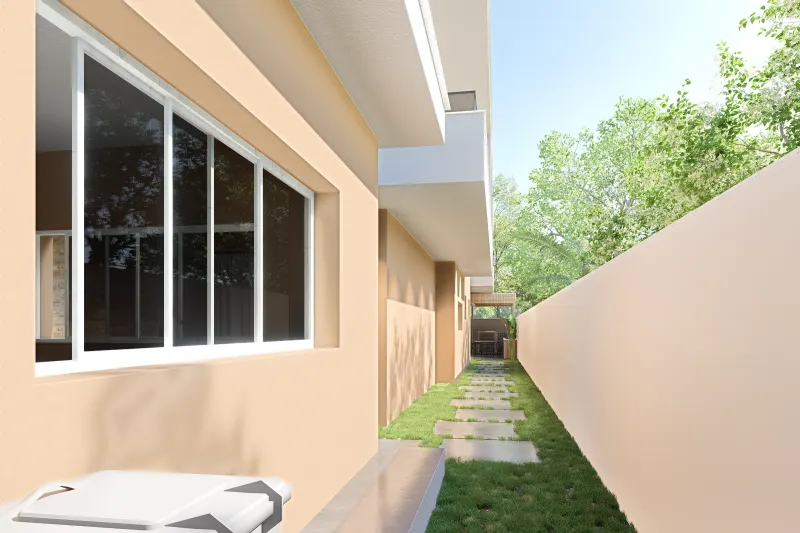 Corredor lateral da habitação com caminho pedonal e muro de vedação.