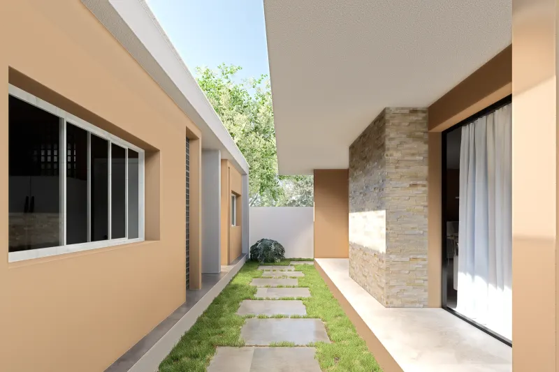 Passadiço exterior lateral com caminho de pedra no relvado e revestimento em pedra
