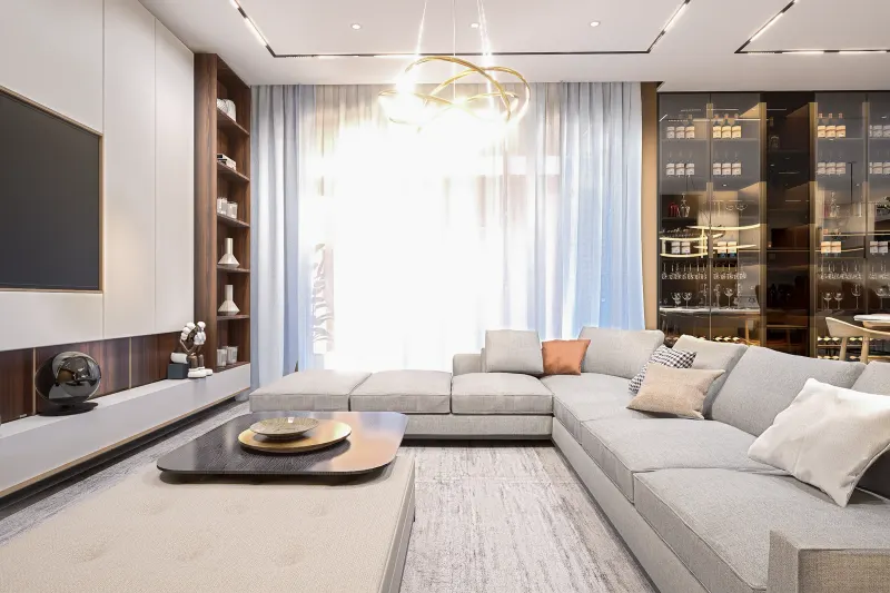 Sala de estar ampla com sofá modular, garrafeira em vidro e móvel de TV