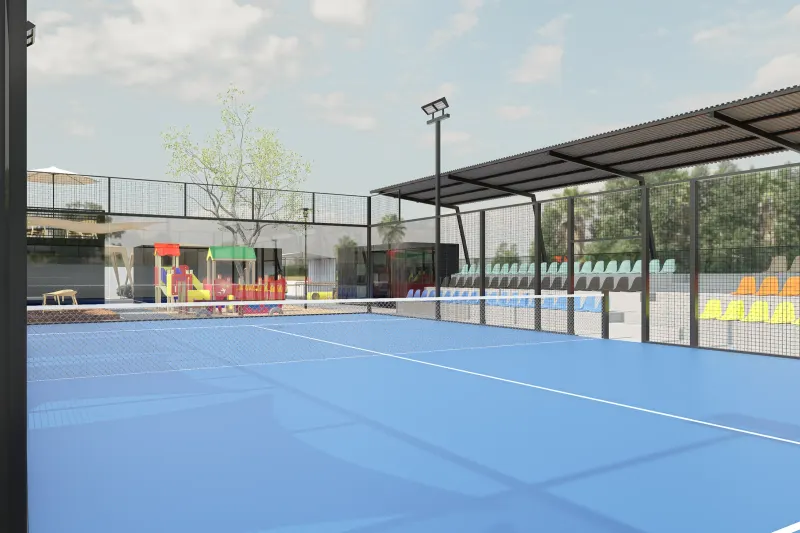 Campo de padel de piso azul com bancada e iluminação desportiva.